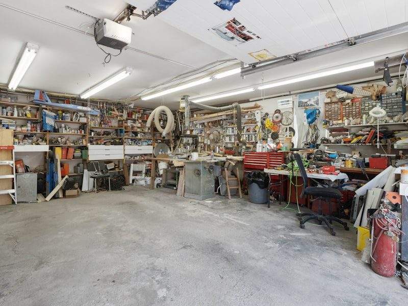 Cluttered garage before cleanout in Poulsbo, WA